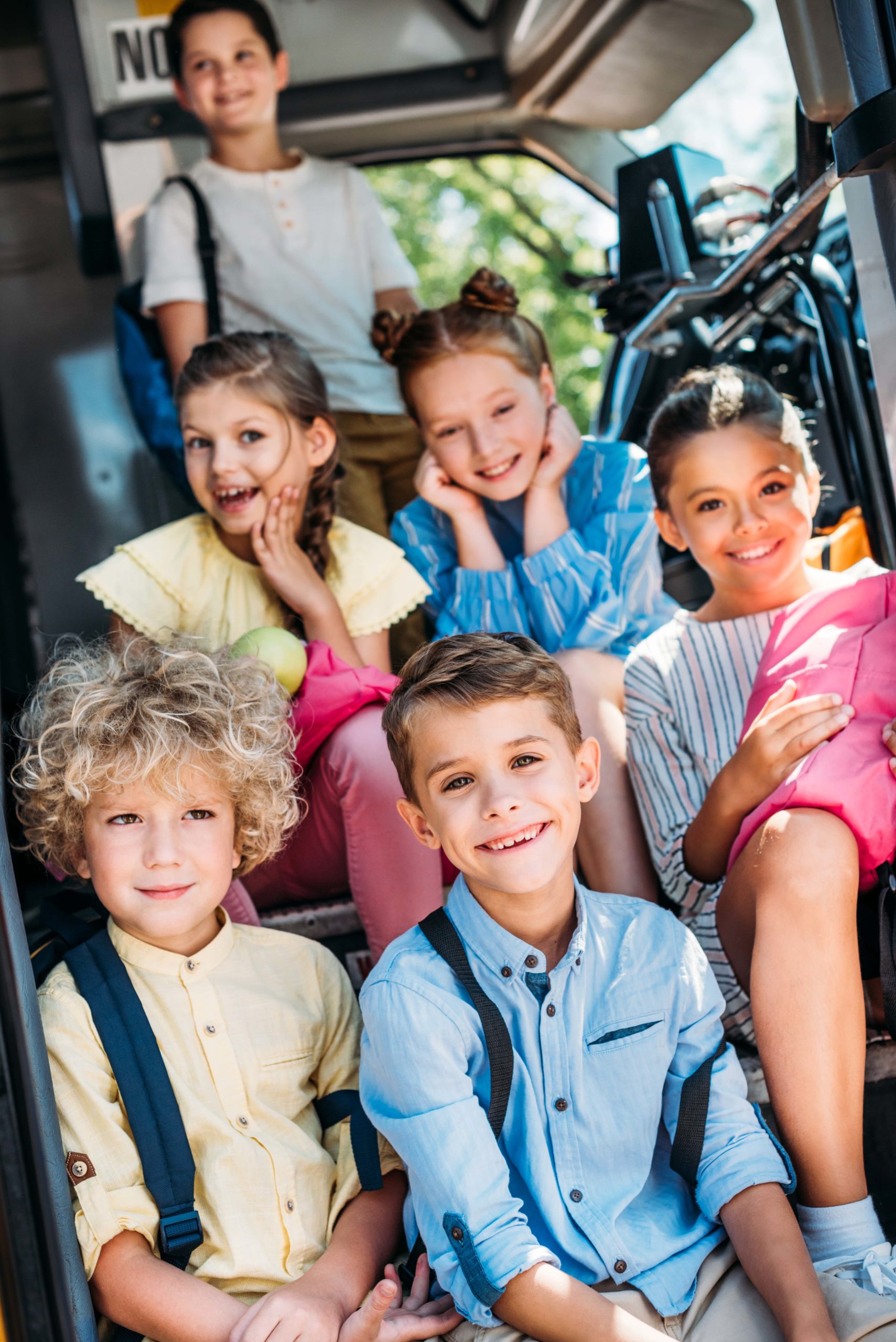 group-of-adorable-pupils-sitting-on-stairs-of-scho-2023-11-27-05-32-21-utc-min